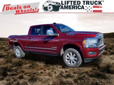 2023 RAM 3500 Limited in a Delmonico Red Pearl Coat exterior color and Blackinterior. Lifted Truck America 888-267-0644 liftedtruckamerica.com 