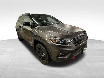 2024 Jeep Compass Trailhawk 4x4 in a Black Clear Coat exterior color and Ruby Red/Blackinterior. Sheridan Motors CDJR 307-218-2217 sheridanmotor.com 