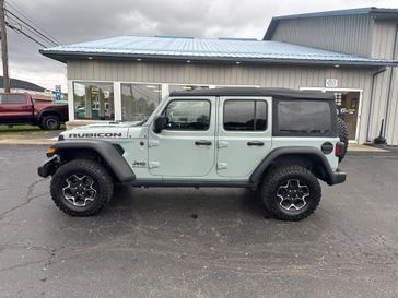 2023 Jeep Wrangler 4-door Rubicon 4x4 in a Earl Clear Coat exterior color and Blackinterior. Victor Chrysler Dodge Jeep Ram 585-236-4391 victorcdjr.com 
