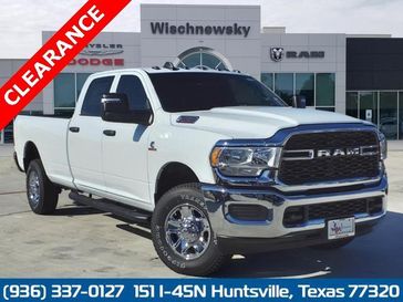 2024 RAM 2500 Tradesman Crew Cab 4x4 8' Box in a Bright White Clear Coat exterior color and Blackinterior. Wischnewsky Dodge 936-755-5310 wischnewskydodge.com 