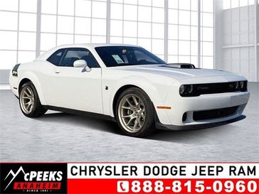2023 Dodge Challenger Scat Pack Swinger in a White Knuckle exterior color. McPeek's Chrysler Dodge Jeep Ram of Anaheim 888-861-6929 mcpeeksdodgeanaheim.com 