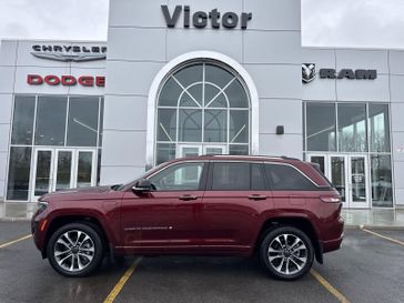 2023 Jeep Grand Cherokee Overland 4xe in a Velvet Red Pearl Coat exterior color and Global Blackinterior. Victor Chrysler Dodge Jeep Ram 585-236-4391 victorcdjr.com 