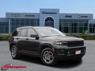 2023 Jeep Grand Cherokee Trailhawk 4xe in a Diamond Black Crystal Pearl Coat exterior color and CAPRI LEATHERinterior. Champion Chrysler Jeep Dodge Ram 800-549-1084 pixelmotiondemo.com 