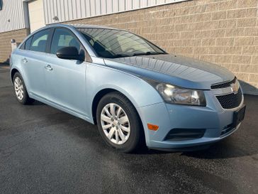 2011 Chevrolet Cruze LS in a Ice Blue Metallic exterior color and Jet Black/Medium Titaniuminterior. Wilmington Auto Center Chrysler Dodge Jeep Ram (937) 556-6430 wilmingtonautocentercdjr.com 