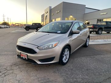 2017 Ford Focus SE in a White Gold exterior color and Medium Light Stoneinterior. Legacy Auto Center 620-315-9264 legacyautocenter.net 