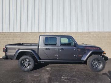 2024 Jeep Gladiator Mojave X 4x4 in a Granite Crystal Metallic Clear Coat exterior color and Green/Blackinterior. Wilmington Auto Center Chrysler Dodge Jeep Ram (937) 556-6430 wilmingtonautocentercdjr.com 