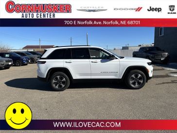 2022 Jeep Grand Cherokee 4xe in a Bright White Clear Coat exterior color and Global Blackinterior. Cornhusker Auto Center 402-866-8665 cornhuskerautocenter.com 