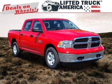 2023 RAM 1500 Classic Tradesman in a Flame Red Clear Coat exterior color and Diesel Gray/Blackinterior. Lifted Truck America 888-267-0644 liftedtruckamerica.com 