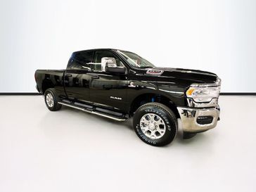 2024 RAM 2500 Laramie Crew Cab 4x4 6'4' Box in a Diamond Black Crystal Pearl Coat exterior color and Blackinterior. Sheridan Motors CDJR 307-218-2217 sheridanmotor.com 