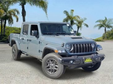 New 2026 Jeep Gladiator Sport S in a Gray exterior color and Blackinterior. Southbay Chrysler Jeep Dodge Ram (424) 404-5521 pixelmotiondemo.com 