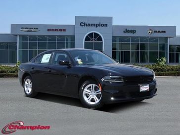 2023 Dodge Charger SXT Rwd in a Pitch Black exterior color and HOUNDSTOOTH CLOinterior. Champion Chrysler Jeep Dodge Ram 800-549-1084 pixelmotiondemo.com 