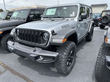 2024 Jeep Wrangler 4-door Willys in a Silver Zynith Clear Coat exterior color and Blackinterior. CDJR of Anytown 949-555-4321 pixelmotiondemo.com 