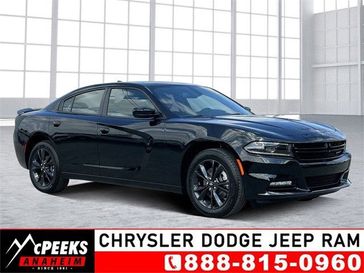 2023 Dodge Charger SXT Awd in a Pitch Black exterior color and Blackinterior. McPeek's Chrysler Dodge Jeep Ram of Anaheim 888-861-6929 mcpeeksdodgeanaheim.com 