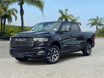 New 2026 RAM 1500 Laramie Crew Cab 4x4 5'7' Box in a Diamond Black Crystal Pearl Coat exterior color and Sea Salt/Bison Browninterior. Southbay Chrysler Jeep Dodge Ram (424) 404-5521 pixelmotiondemo.com 