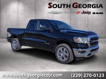 2023 RAM 1500 Big Horn Quad Cab 4x4 6'4' Box in a Diamond Black Crystal Pearl Coat exterior color and Blackinterior. South Georgia CDJR 229-443-1466 southgeorgiacdjr.com 