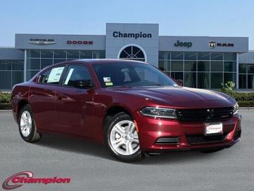 2023 Dodge Charger SXT Rwd in a Octane Red exterior color and HOUNDSTOOTHinterior. Champion Chrysler Jeep Dodge Ram 800-549-1084 pixelmotiondemo.com 