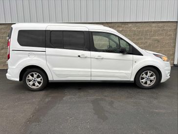 2015 Ford Transit Connect XLT in a Frozen White exterior color and Charcoal Blackinterior. Wilmington Auto Center Chrysler Dodge Jeep Ram (937) 556-6430 wilmingtonautocentercdjr.com 