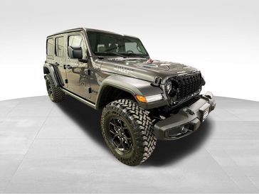 2024 Jeep Wrangler 4-door Willys in a Granite Crystal Metallic Clear Coat exterior color. Sheridan Motors CDJR 307-218-2217 sheridanmotor.com 