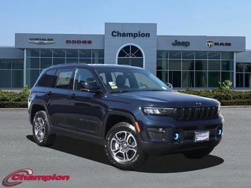 2023 Jeep Grand Cherokee Trailhawk 4xe in a Midnight Sky exterior color and CAPRI LEATHERinterior. Champion Chrysler Jeep Dodge Ram 800-549-1084 pixelmotiondemo.com 