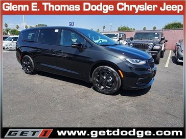 2023 Chrysler Pacifica Plug-in Hybrid Touring L in a Brilliant Black Crystal Pearl Coat exterior color and Blackinterior. Glenn E Thomas 100 Years Of Excellence (866) 340-5075 getdodge.com 