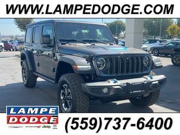 2024 Jeep Wrangler 4-door Rubicon 4xe in a Granite Crystal Metallic Clear Coat exterior color and Blackinterior. Lampe Chrysler Dodge Jeep RAM 559-471-3085 pixelmotiondemo.com 