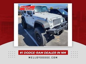 2015 Jeep Wrangler Unlimited Rubicon in a Bright White Clear Coat exterior color and Blackinterior. Melloy Dodge RAM FIAT 505-588-4459 melloydodge.com 