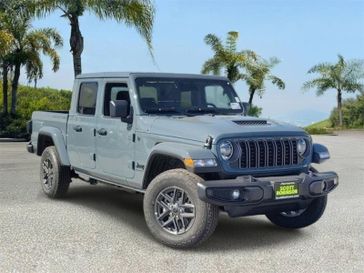 New 2026 Jeep Gladiator Sport S in a Gray exterior color and Blackinterior. Southbay Chrysler Jeep Dodge Ram (424) 404-5521 pixelmotiondemo.com 