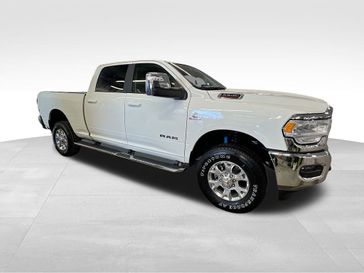 2024 RAM 2500 Laramie Crew Cab 4x4 6'4' Box in a Pearl White exterior color and Blackinterior. Sheridan Motors CDJR 307-218-2217 sheridanmotor.com 