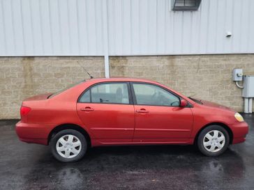 2006 Toyota Corolla LE in a Impulse Red Pearl exterior color and FB11interior. Wilmington Auto Center Chrysler Dodge Jeep Ram (937) 556-6430 wilmingtonautocentercdjr.com 