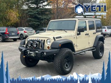 2011 Jeep Wrangler Unlimited Rubicon in a Sahara Tan Clear Coat exterior color. Rocky Mountain Yeti Jackson Hole 307-733-5337 rockymountainyetijacksonhole.com 