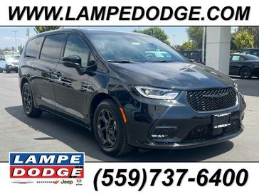 2023 Chrysler Pacifica Plug-in Hybrid Touring L in a Brilliant Black Crystal Pearl Coat exterior color and Blackinterior. Lampe Chrysler Dodge Jeep RAM 559-471-3085 pixelmotiondemo.com 