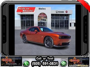 2022 Dodge Challenger  in a Sinamon Stick exterior color and Blackinterior. Melloy Dodge RAM FIAT 505-588-4459 melloydodge.com 