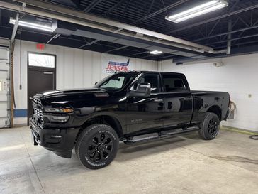 New 2026 RAM 3500 Big Horn Crew Cab 4x4 6'4' Box in a Diamond Black Crystal Pearl Coat exterior color and Blackinterior. Jensen Chrysler Dodge Jeep Ram 507-354-0542 jensenchryslerdodgejeepram.com 