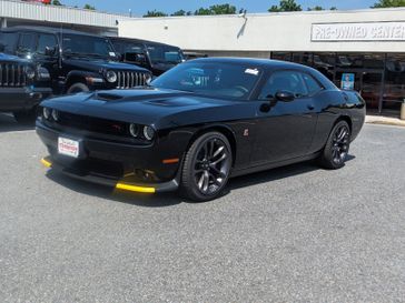 2023 Dodge Challenger R/T Scat Pack in a Pitch-Black exterior color and Blackinterior. Don White's Timonium Chrysler Dodge Jeep Ram 410-881-5409 donwhites.com 