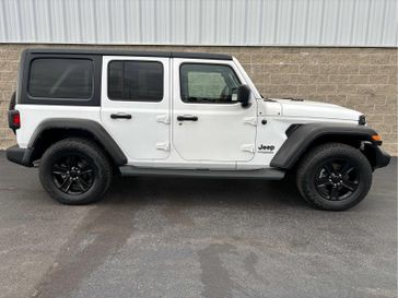 2021 Jeep Wrangler Unlimited Sport Altitude in a Bright White Clear Coat exterior color and Blackinterior. Wilmington Auto Center Chrysler Dodge Jeep Ram (937) 556-6430 wilmingtonautocentercdjr.com 