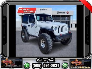 2020 Jeep Wrangler Sport S in a Bright White Clear Coat exterior color and Blackinterior. Melloy Dodge RAM FIAT 505-588-4459 melloydodge.com 