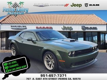 2023 Dodge Challenger Scat Pack Swinger in a F8 Green exterior color and -X9interior. Perris Valley Chrysler Dodge Jeep Ram 951-355-1970 perrisvalleydodgejeepchrysler.com 