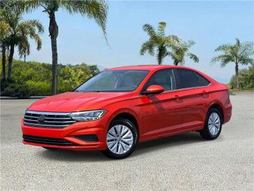 Used 2019 Volkswagen Jetta S Auto w/SULEV in a Habanero Orange Metallic exterior color and Storm Grayinterior. Southbay Chrysler Jeep Dodge Ram (424) 404-5521 pixelmotiondemo.com 
