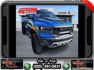 2022 RAM 1500 TRX in a Hydro Blue Pearl Coat exterior color and Blackinterior. Melloy Dodge RAM FIAT 505-588-4459 melloydodge.com 