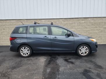 2012 Mazda Mazda5 Sport in a Metropolitan Gray exterior color and Sandinterior. Wilmington Auto Center Chrysler Dodge Jeep Ram (937) 556-6430 wilmingtonautocentercdjr.com 