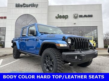 2023 Jeep Gladiator Willys 4x4 in a Hydro Blue Pearl Coat exterior color and Blackinterior. McCarthy Jeep Ram 816-434-0674 mccarthyjeepram.com 