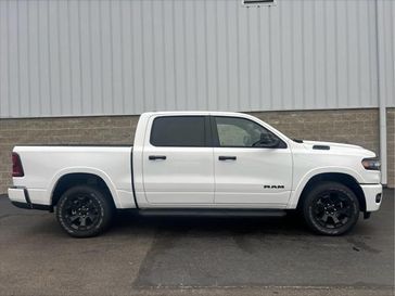 2025 RAM 1500 Big Horn Crew Cab 4x4 5'7' Box in a Bright White Clear Coat exterior color. Wilmington Auto Center Chrysler Dodge Jeep Ram (937) 556-6430 wilmingtonautocentercdjr.com 