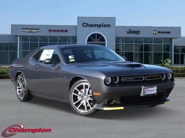 2023 Dodge Challenger R/T in a Granite exterior color and HOUNDSTOOTHinterior. Champion Chrysler Jeep Dodge Ram 800-549-1084 pixelmotiondemo.com 