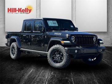 2024 Jeep Gladiator Willys 4x4 in a Black Clear Coat exterior color. Hill-Kelly Dodge (850) 786-2130 hillkellydodge.com 