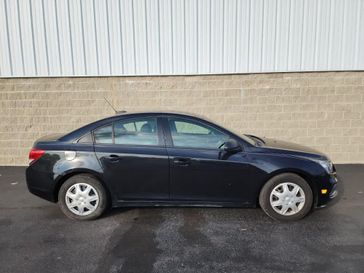 2015 Chevrolet Cruze LS in a Black Granite Metallic exterior color and Jet Black/Medium Titaniuminterior. Wilmington Auto Center Chrysler Dodge Jeep Ram (937) 556-6430 wilmingtonautocentercdjr.com 