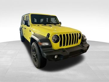 2023 Jeep Wrangler 4-door Sport Altitude 4x4 in a High Velocity Clear Coat exterior color and Blackinterior. Sheridan Motors CDJR 307-218-2217 sheridanmotor.com 