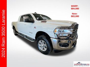 2024 RAM 3500 Laramie Mega Cab 4x4 6'4' Box in a Pearl White exterior color and Blackinterior. Sheridan Motors CDJR 307-218-2217 sheridanmotor.com 