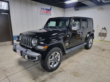 Used 2018 Jeep Wrangler Unlimited Sahara in a Black Clear Coat exterior color and Black/Heritage Taninterior. Jensen Chrysler Dodge Jeep Ram 507-354-0542 jensenchryslerdodgejeepram.com 