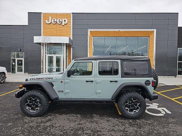 2023 Jeep Wrangler 4-door Rubicon 4x4 in a Earl Clear Coat exterior color and Blackinterior. Victor Chrysler Dodge Jeep Ram 585-236-4391 victorcdjr.com 