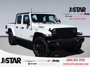 2023 Jeep Gladiator Willys 4x4 in a Bright White Clear Coat exterior color and Blackinterior. J Star Chrysler Dodge Jeep Ram of Anaheim Hills 888-802-2956 jstarcdjrofanaheimhills.com 
